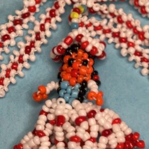 Native American, glass beaded doll pendant.